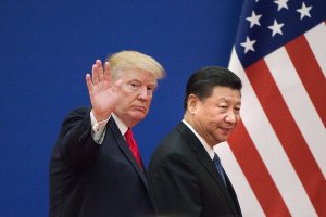 President Donald Trump and China's President Xi Jinping leave a business leaders event at the Great Hall of the People in Beijing on November 9, 2017. (Credit: NICOLAS ASFOURI/AFP/Getty Images)