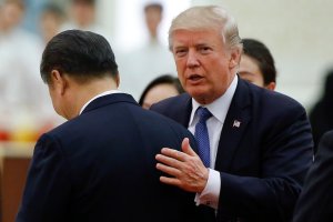 U.S. President Donald Trump speaks to China's President Xi Jinping during a state dinner in the Great Hall of the People in Beijing on Nov. 9, 2017. (Credit: Thomas Peter / AFP / Getty Images)