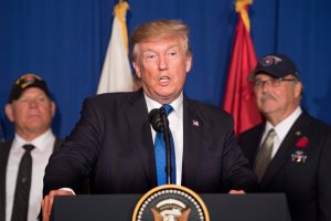 US President Donald Trump participates in a veterans meet and greet on the sidelines of the Asia-Pacific Economic Cooperation (APEC) leaders' summit in the central Vietnamese city of Danang on November 10, 2017. (Credit: JIM WATSON/AFP/Getty Images)