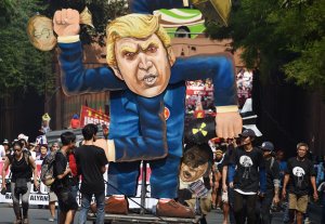 Protesters gather around an effigy of U.S. President Donald Trump prior to a march to ASEAN Summit venue in Manila on Nov. 13, 2017. (Credit: Ted Aljibe / AFP / Getty Images)