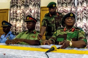 Zimbabwe Army General Constantino Chiwenga Commander of the Zimbabwe Defence Forces, right, and Valerio Sibanda Commander of the Zimbabwe National Army, second from left, address a media conference held at the Zimbabwean Army headquarters in Harare on Nov. 13, 2017. (Credit: Jekesai Njikizana / AFP / Getty Images)