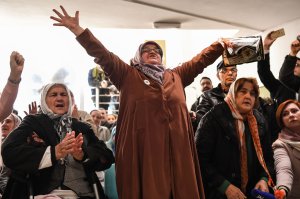 Victims' relatives react as they watch a live TV broadcast from the International Criminal Tribunal for the former Yugoslavia in a room at the memorial in Potocari, near Srebrenica on Nov. 22, 2017, when UN judges announce the life sentence in the trial of former Bosnian Serbian commander Ratko Mladic. (Credit: DIMITAR DILKOFF/AFP/Getty Images)