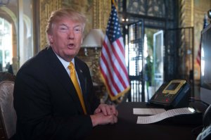 Donald Trump prepares his traditional address to thank members of the U.S. military via video teleconference from his residence in Mar-a-Lago in Florida on Thanksgiving Day, November 23, 2017. (Credit: Nicholas Kamm/AFP/Getty Images)