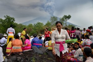 Balinese Hindus take part in a ceremony, where they pray near Mount Agung in hope of preventing a volcanic eruption, in Muntig village on Indonesia's resort island of Bali, Nov. 26, 2017. (Credit: Sonny Tumbelaka / AFP / Getty Images)