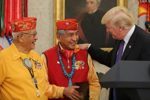 President Donald Trump greets members of the Native American code talkers during an event in the Oval Office of the White House, on Nov. 27, 2017. (Credit: Oliver Contreras -pool/Getty Images)