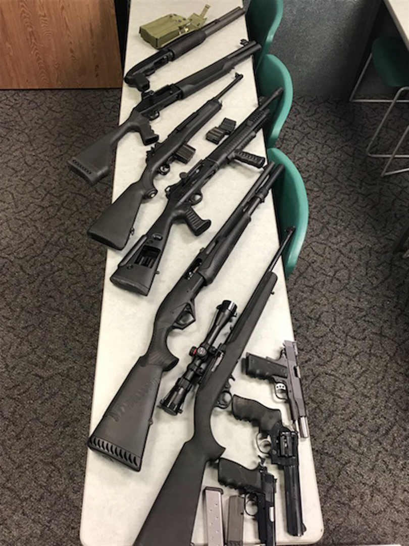Guns recovered after David Kenneth Smith's arrest are shown in a photo released by the O.C. Sheriff's Department on Nov. 6, 2017.