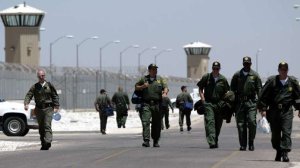 Guards arrive for their shifts at the California State Prison in Lancaster in 2004. (Credit: Bryan Chan/Los Angeles Times)