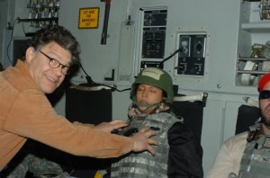 A photo shared by Leeann Tweeden on KABC.com shows Al Franken groping her breasts as she slept at an Army base in Iraq in 2006.