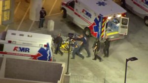 Luvelle Kennon is seen being transported on a stretcher after being shot by police following a standoff at a Riverside elementary school on Oct. 31, 2017. (Credit: Sky5 / KTLA)