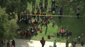 Students at Castleview Elementary School are evacuated after one of their teachers was taken hostage in a classroom on Oct. 31, 2017. (Credit: Sky5 / KTLA)