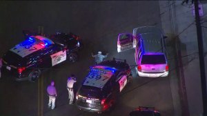 A pursuit suspect surrendered to authorities and was taken into custody in the Mid-City area on Nov. 2, 2017. (Credit: KTLA)