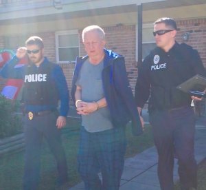 Slidell police released this photo of Michael Neu being taken into custody.