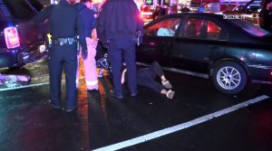 Crews attend to a woman who was struck by a hit-and-run driver in Anaheim on Dec. 20, 2017. (Credit: OnScene.TV)