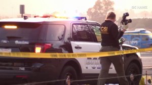 An investigator walks by a Colton police patrol car at the scene of an officer-involved shooting that left a man dead on Dec. 2, 2017. (Credit: OC Hawk)