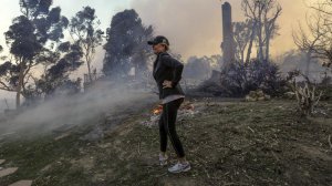 Judy Hofmann-Sanders survey's the area after her home was consumed by the Creek fire along McBroom Street in Shadow Hills in December, 2017. (Credit: Irfan Khan / Los Angeles Times)