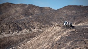 Los Angeles County sheriff's officials survey damage after the Creek Fire near Sylmar scorched a hillside in a photo released by the Sheriff's Department on Dec. 9, 2017.