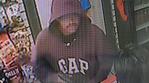 A still from a surveillance video released by police on Dec. 10, 2017 shows a man allegedly involved in an armed robbery at a gas station in Irvine. (Credit: Irvine Police Department)