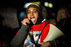 Erica Garner, daughter of Eric Garner, leads a march of people protesting the Staten Island, New York grand jury's decision not to indict a police officer involved in the chokehold death of Eric Garner in July, on December 11, 2014. (Credit: Andrew Burton/Getty Images)