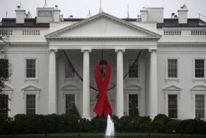 A red ribbon is displayed on the North Portico of the White House to recognize World AIDS Day, December 1, 2015 in Washington, DC. (Credit: Mark Wilson/Getty Images)
