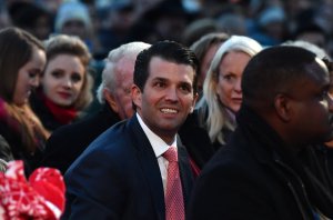 Donald Trump Jr. smiles as he waits for the arrival of President Donald Trump before the 95th annual National Christmas Tree Lighting ceremony near the White House on Nov. 30, 2017. (Credit: Nicholas Kamm / AFP / Getty Images)