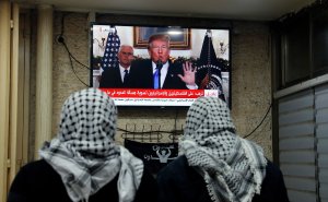 A photo taken on Dec. 6, 2017 shows Palestinian men watching an address given by Donald Trump at a cafe in Jerusalem. (Credit: AHMAD GHARABLI/AFP/Getty Images)