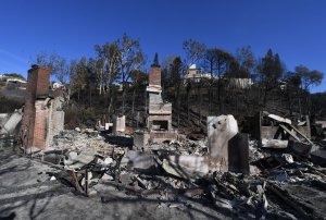 A burnt out house is seen after the Skirball wildfire swept through the exclusive enclave of Bel-Air on Dec. 7, 2017. (Credit: AFP PHOTO / Mark Ralston)