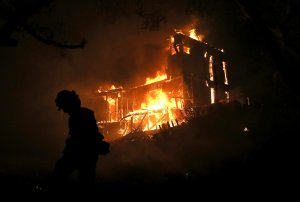 A home is consumed by fire during the Thomas fire on December 7, 2017 in Ojai. (Credit: Justin Sullivan/Getty Images)