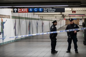 Police stand in a closed-off underground walkway near the site of a pipe bomb explosion in the tunnel that connects the Times Square subway station to the Port Authority Bus Terminal, Dec. 11, 2017, in New York City. (Credit: Drew Angerer/Getty Images)