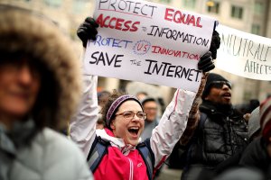 Demonstrators rally outside the Federal Communication Commission building to protest against the end of net neutrality rules Dec. 14, 2017, in Washington, DC. (Credit: Chip Somodevilla / Getty Images)