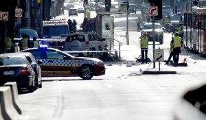 Police and emergency personnel work at the scene of where a car ran over pedestrians in Flinders Street in Melbourne on Dec. 21, 2017. (Credit: Mal Fairclough/AFP/Getty Images)