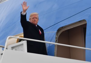 US President Donald J. Trump waves before boarding Airforce One at Joint Base Andrews, Maryland on December 22, 2017. (Credit: NICHOLAS KAMM/AFP/Getty Images)