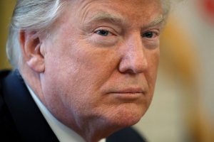U.S. President Donald Trump prepares to sign sweeping tax reform legislation into law in the Oval Office at the White House December 22, 2017 in Washington, DC. (Credit: Chip Somodevilla/Getty Images)