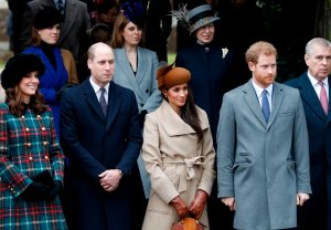 Britain's Catherine, Duchess of Cambridge, and Britain's Prince William, Duke of Cambridge, actress and fiancee of Britain's Prince Harry Meghan Markle, and Britain's Prince Harry, stand together as they wait to see off Britain's Queen Elizabeth II after attending the Royal Family's traditional Christmas Day church service at St Mary Magdalene Church in Sandringham, Norfolk, eastern England, on December 25, 2017.(Credit: ADRIAN DENNIS/AFP/Getty Images)