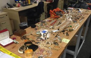 Investigators were looking to find the owners of the jewelry and other items seen in this photo provided by the Orange County Sheriff's Department on Dec. 21, 2017.