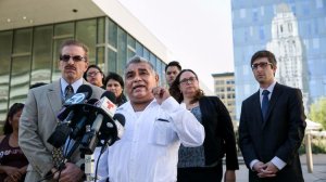 Aureliano Santiago, a street vendor, answers questions from reporters during a 2015 news conference about a lawsuit filed against the city of Los Angeles. Santiago was a plaintiff in the case. (Credit: Marcus Yam / Los Angeles Times)