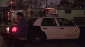 The L.A. County Sheriff's Department investigates a shooting that left a woman dead and the suspect injured on Dec. 25, 2017. (Credit: KTLA)