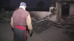 "Tony" Roberts looks on at what is left of his Ventura home that was destroyed in the Thomas Fire on Dec. 6, 2017. (Credit: KTLA)