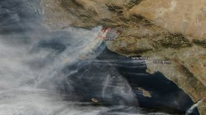 A satellite photo from NASA shows multiple columns of gray-brown smoke coming from the Thomas Fire that is raging in Ventura County on Dec. 7, 2017. 