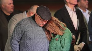 Pastor Frank Pomeroy comforts his wife Sherri during a memorial service for the victims of the First Baptist Church of Southerland Springs shootings at the Floresville High School on Nov. 8, 2017, in Floresville, Texas. (Credit: Scott Olson/Getty Images)