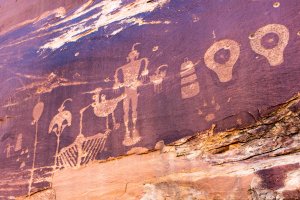 Ancient rock art, shown in this undated CNN photo, is pockmarked by bullet holes.