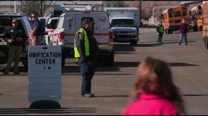 Students gather in the parking lot at Aztec High School in Aztec, New Mexico, after a deadly shooting occurred there on Dec. 7, 2017. (Credit: KOAT via CNN)