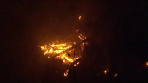 The Skirball Fire flares in Bel-Air on Dec. 6, 2017. (Credit: KTLA) 