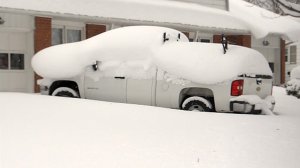 A truck is seen covered in snow in Erie, Pennsylvania. (Credit: CNN)