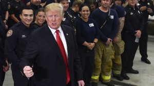 President Donald Trump speaks to first responders at West Palm Beach Fire & Rescue in West Palm Beach, Fla. on Dec. 27, 2017. During his visit, he made the false claim that the first term of his presidency saw more laws signed than any other. (Credit: Nicholas Kamm/AFP/Getty Images)