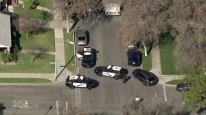 Burbank police serve a search warrant at a home in the 1800 block of North Niagara Street on Jan. 24, 2018. (Credit: KTLA)