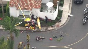 The helicopter hit a home when it crashed in Newport Beach on Jan. 30, 2018. (Credit: KTLA)