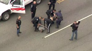 A man and a woman are taken into custody in Montebello after leading police on a lengthy pursuit in the Southeast L.A. area on Jan. 3, 2018. (Credit: KTLA)