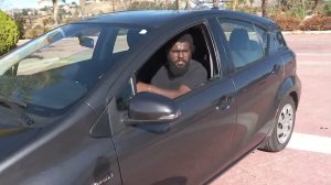 Desionne Franklin sits in his Prius Jan. 11, 2018, two days after riding it down a river of mud in Burbank. (Credit: KTLA)