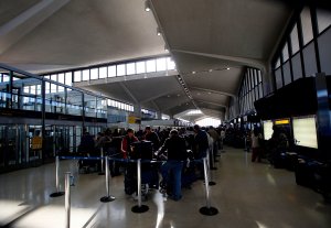 Travelers line up at ticketing counters at Newark Liberty International Airport Terminal B follwinf a major blizzard on December 27, 2010 in Newark, New Jersey. (Credit: Jeff Zelevansky/Getty Images)