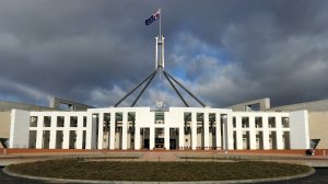 The Australian national flag flies over Parliament House in Canberra on June 20, 2011. (Credit: TORSTEN BLACKWOOD/AFP/Getty Images)